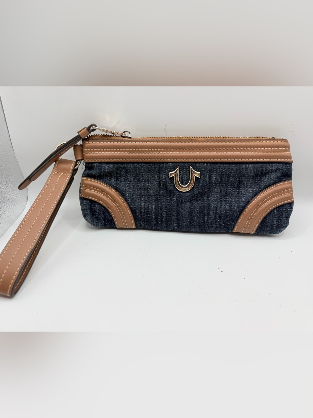 True Religion Denim Wristlet with Tan Trim and Gold Logo